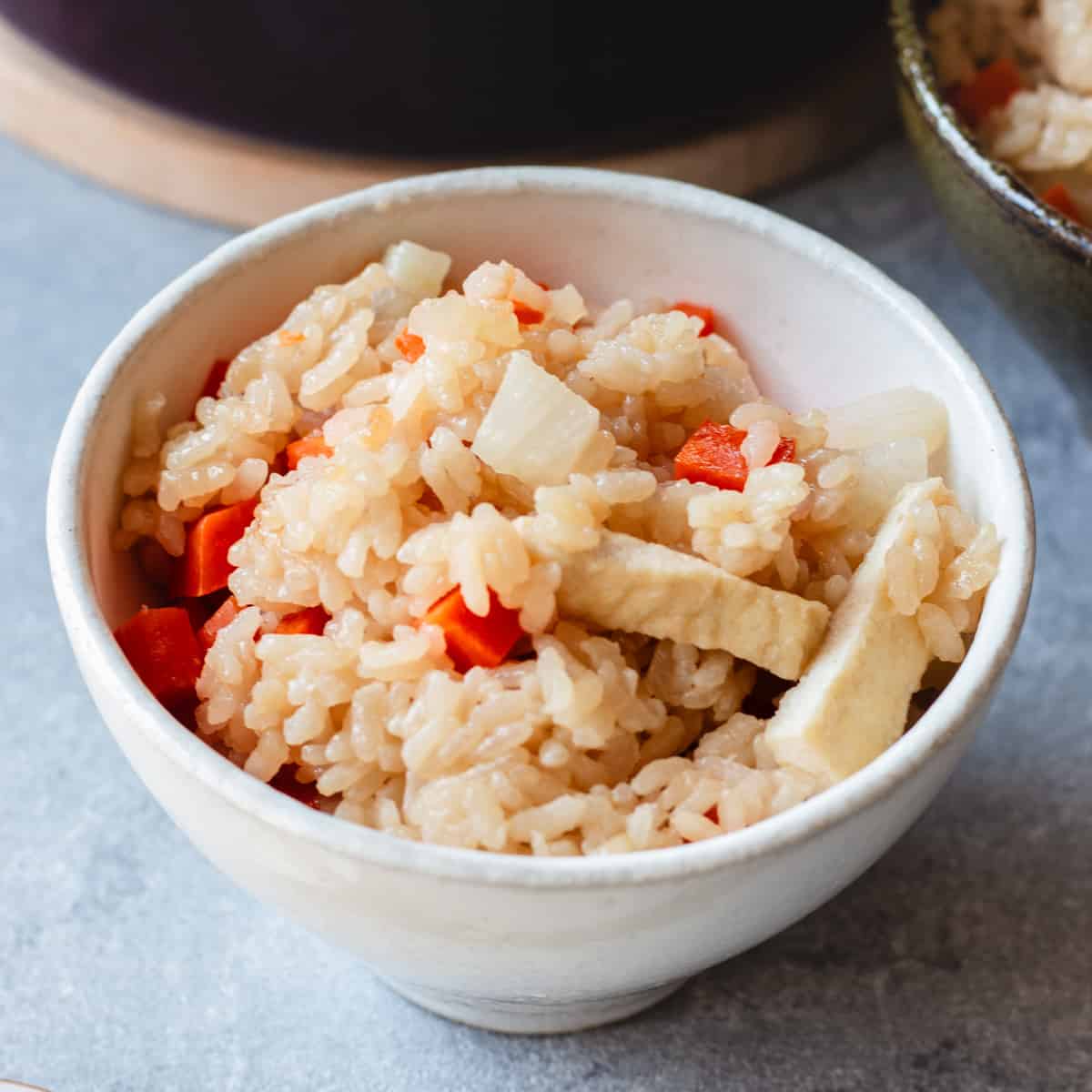 Daikon takikomi gohan served on a bowl.