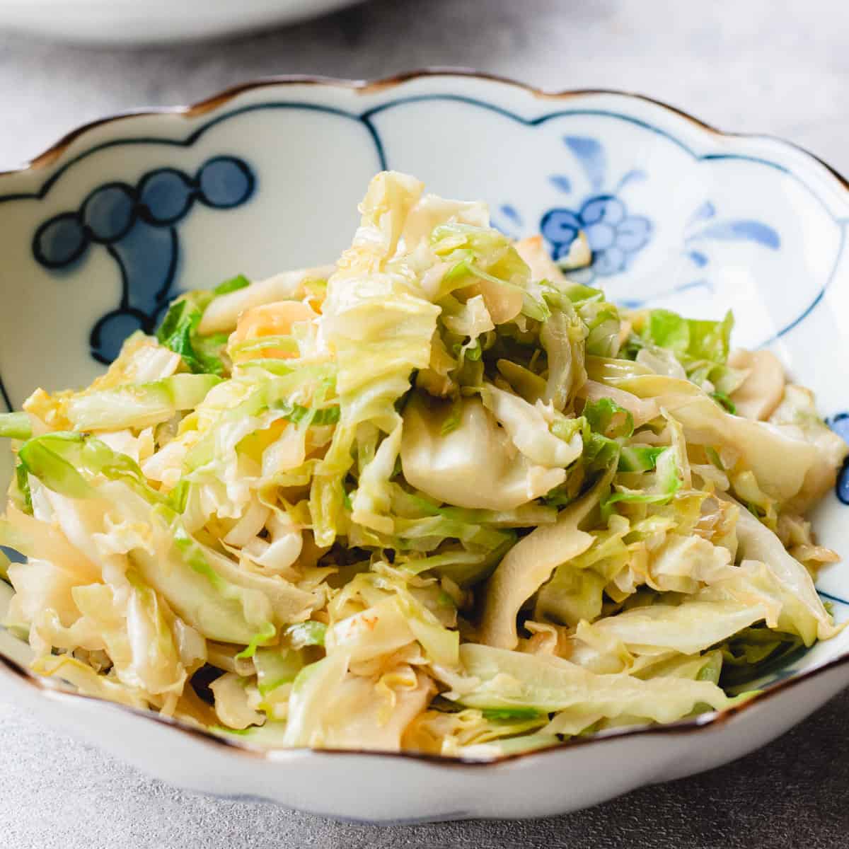 Stir-fried cabbage served on a plate.