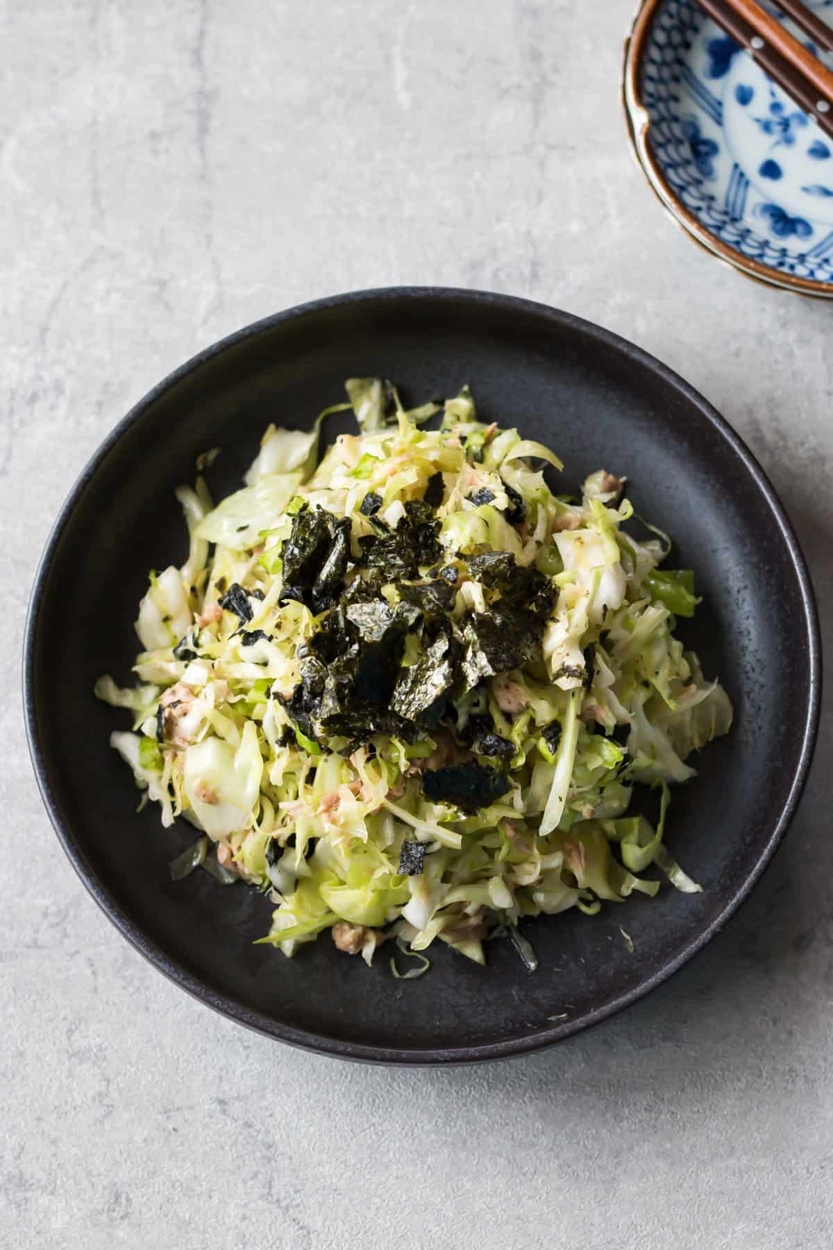 cabbage and tuna salad served on a plate.