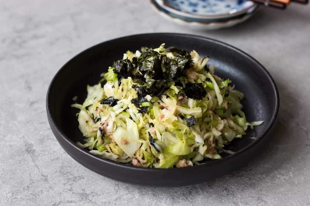 cabbage and tuna salad served on a plate.