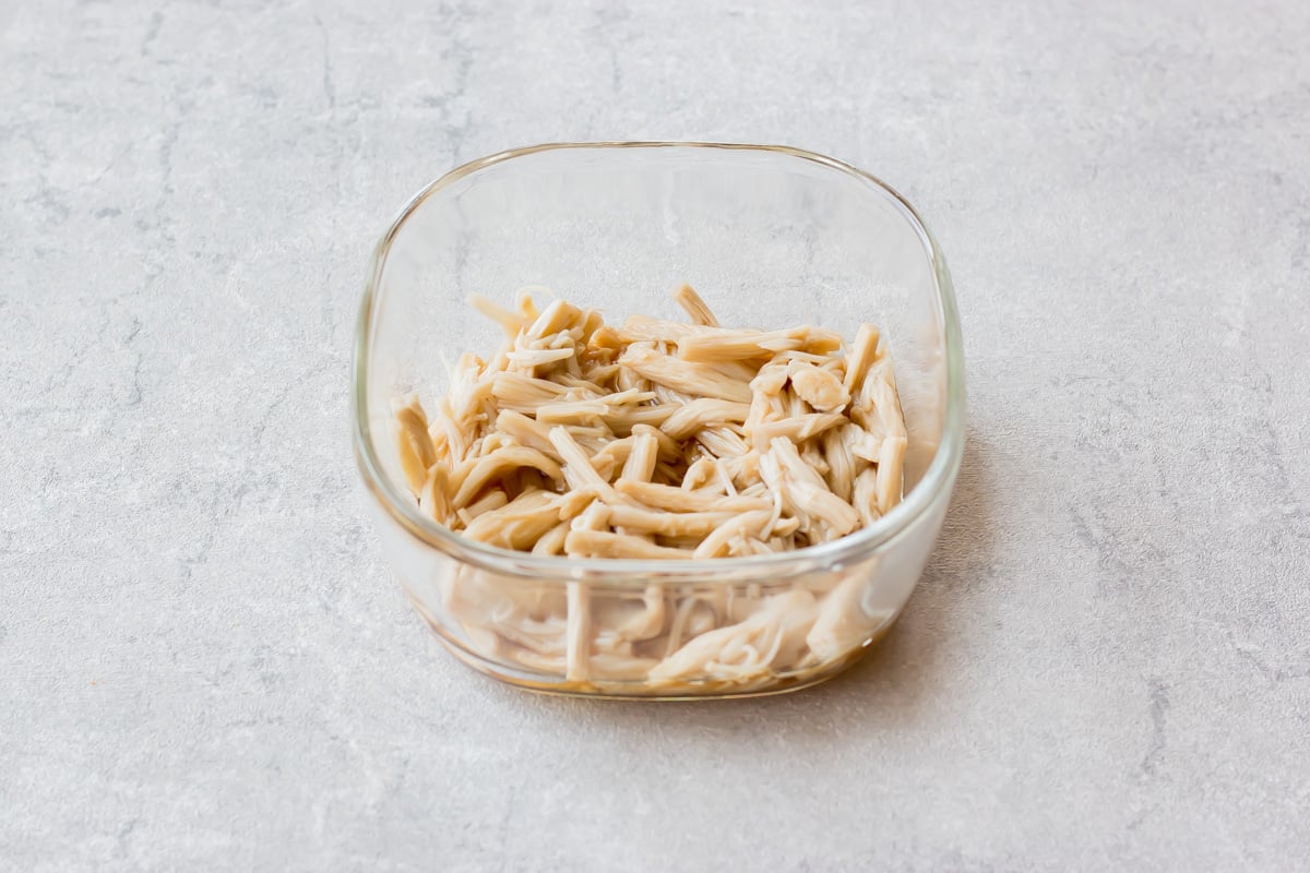 Enoki ohitashi served on a small plate.