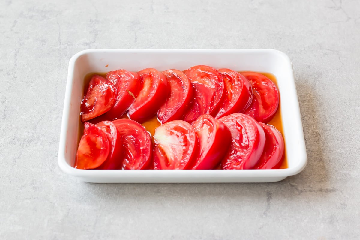Tomato ohitashi served on a plate.