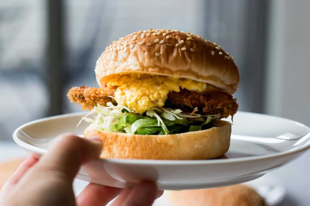 Fish burger served on a plate.