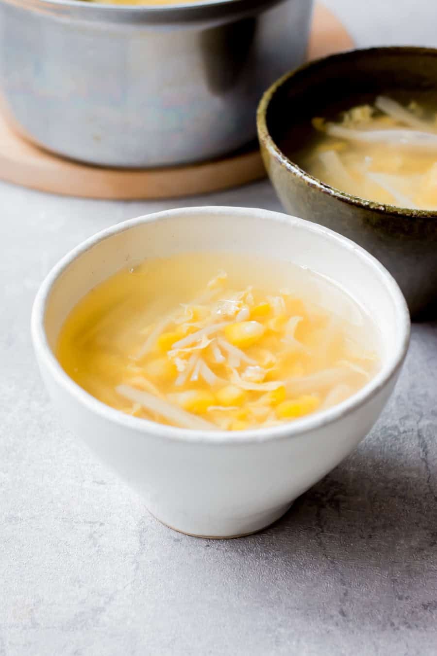 Corn and egg soup served on a bowl.