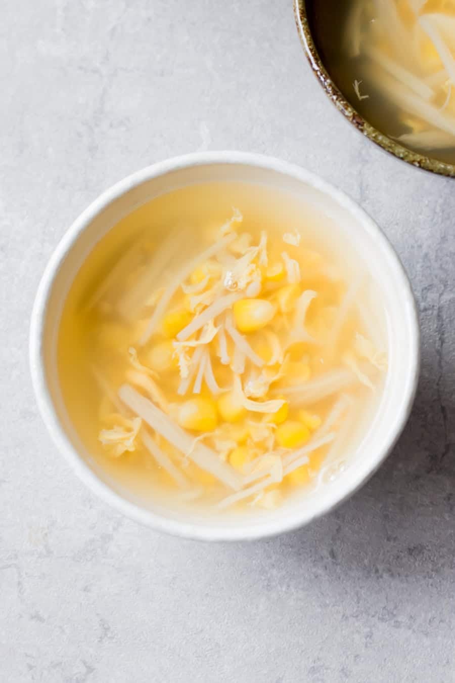Corn and egg soup served on a bowl.