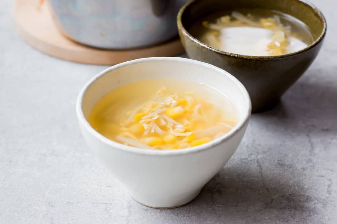 Corn and egg soup served on a bowl.