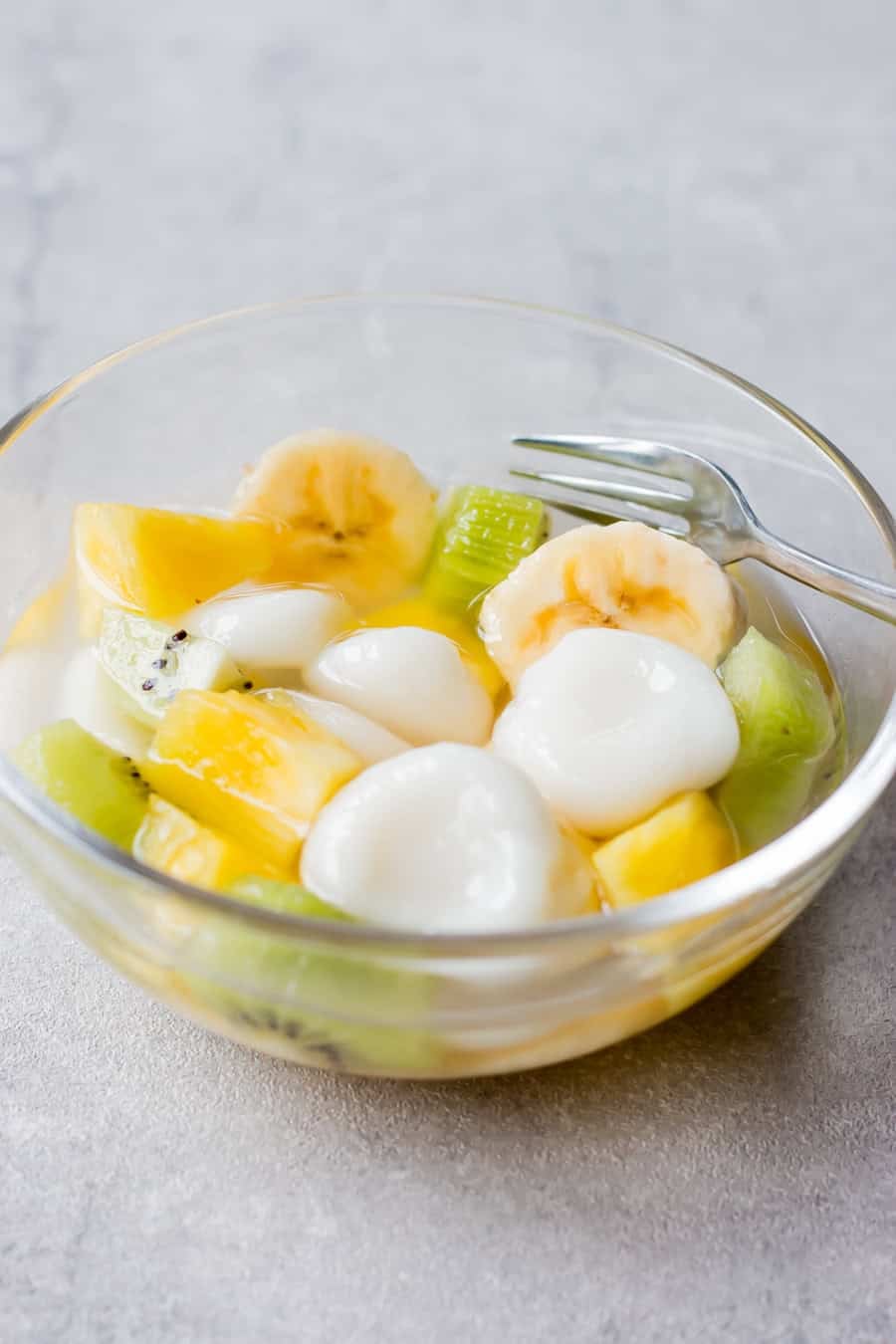 Shiratama dango with fruit served in a bowl.