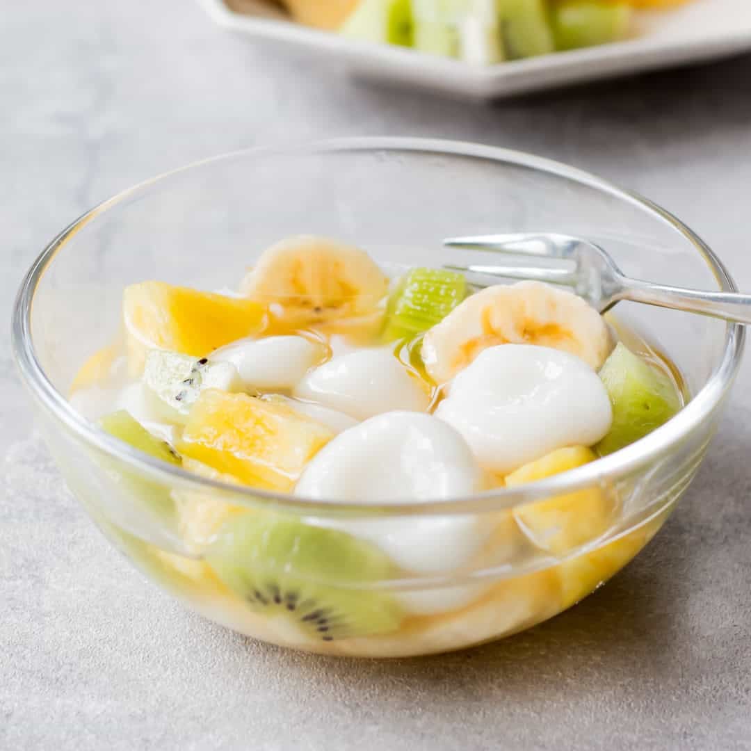 Shiratama dango with fruit served in a bowl.