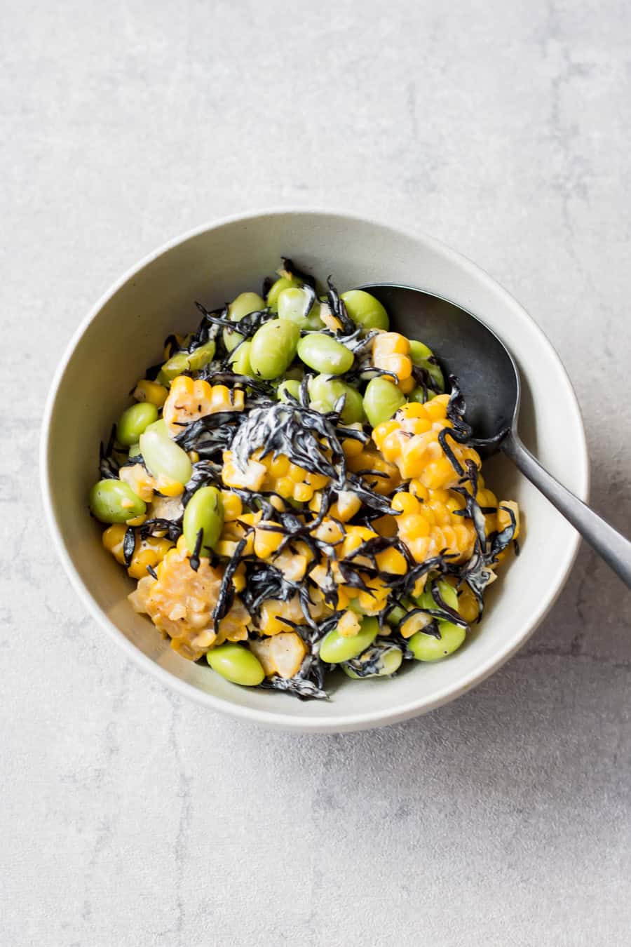 Edamame corn hijiki salad served in a bowl.