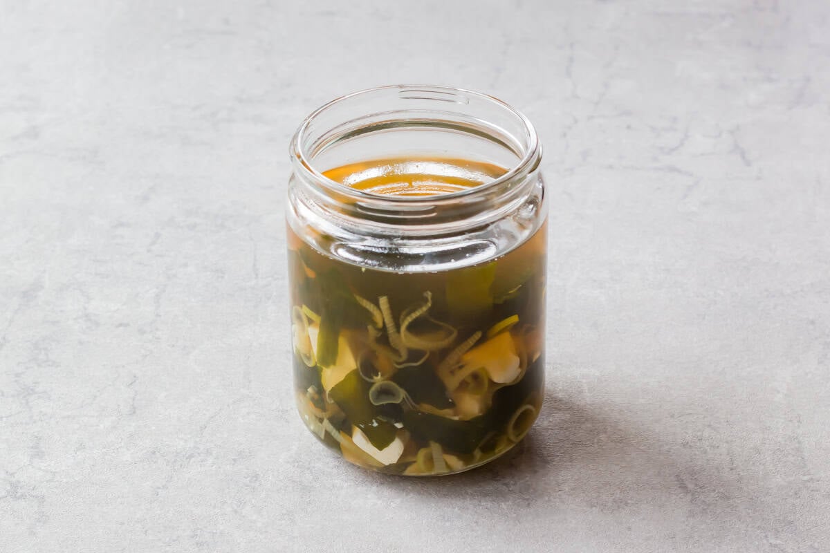 Sumashijiru served in a glass jar.